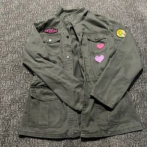 The color of this jacket is almost like an army green, with little patches